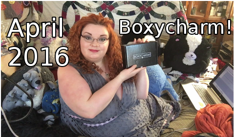 Nico holds up the April 2016 Boxycharm!